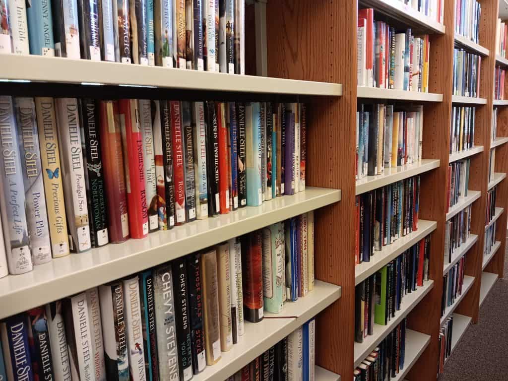 A close up view of books on library shelves