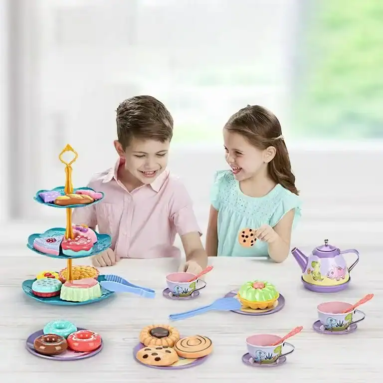 boy and a girl are having a tea party